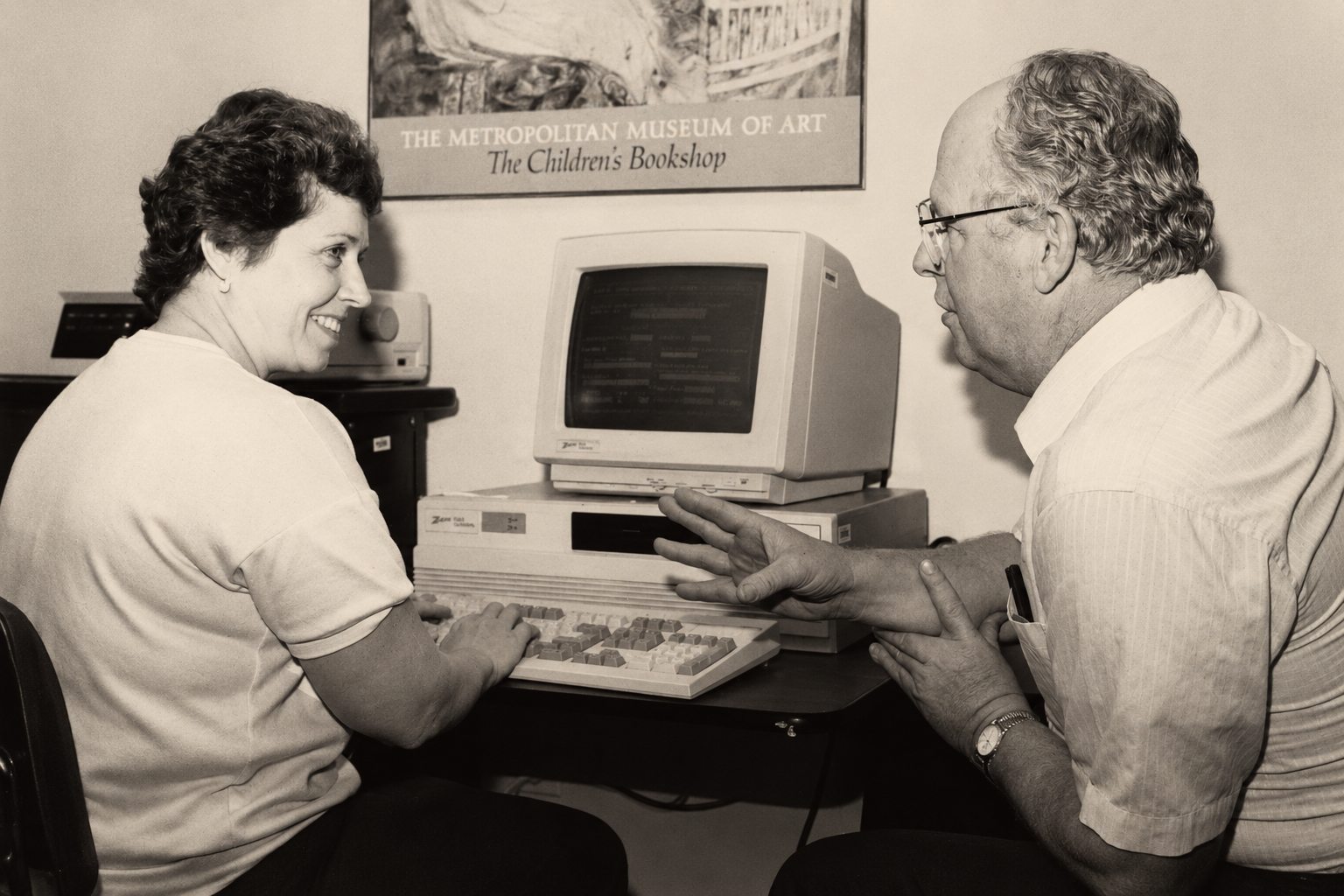 Historic computer operator beside early computing equipment